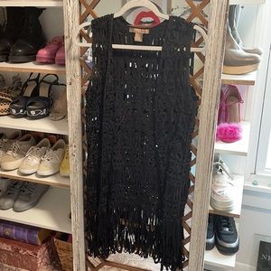 Black vest with lace and fringe details